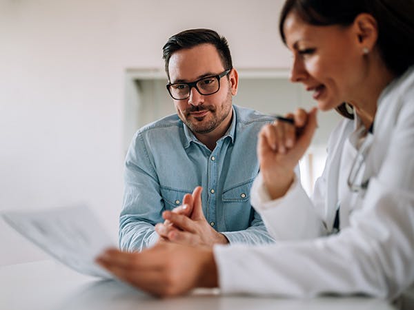 Image of two researchers reviewing a patient reported outcome measure